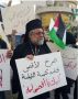 На плакате написано:. «Аль -Акса взывала, и Храм Гроба Господня ответил: "К твоим услугам, о Аль-Акса, к твоим услугам"